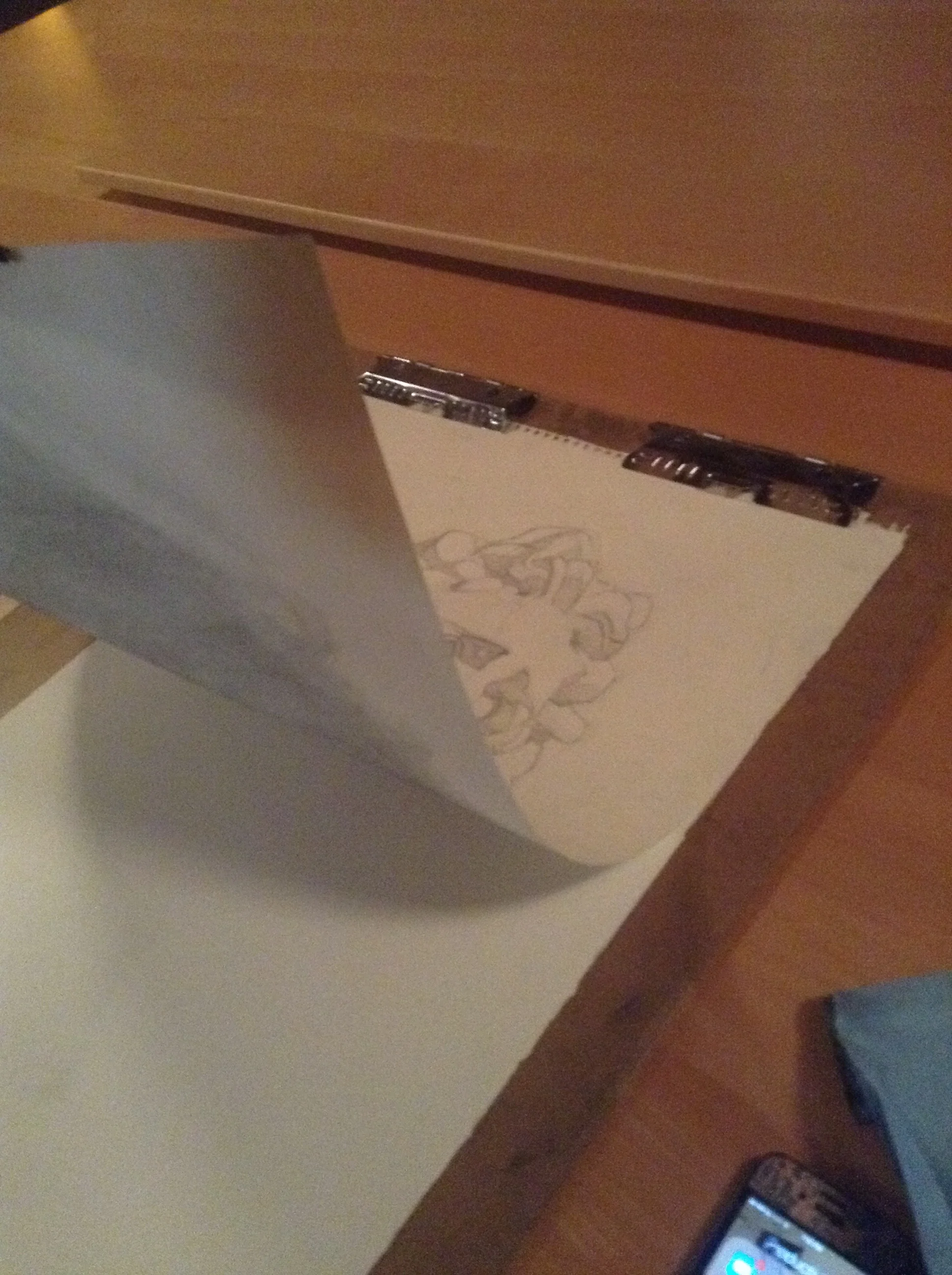 Tape the corners down so the drawing doesn't move. I have clips, but I secured the bottom corners with tape.