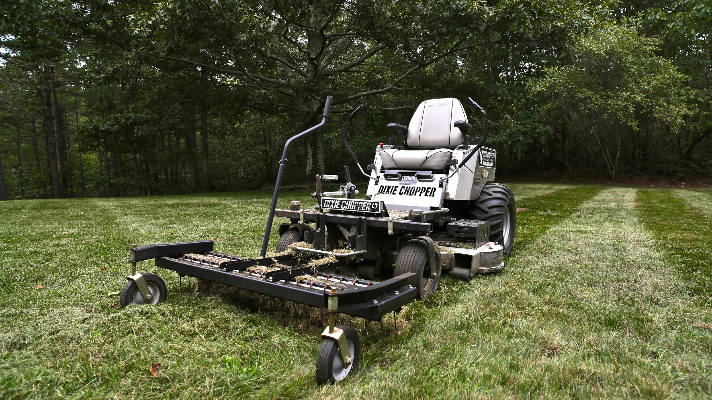 Dixie Chopper with dethatcher attachment. 