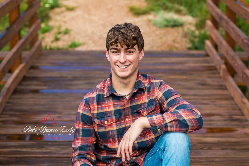 High school senior in an outdoor environment with fresh, natural light.