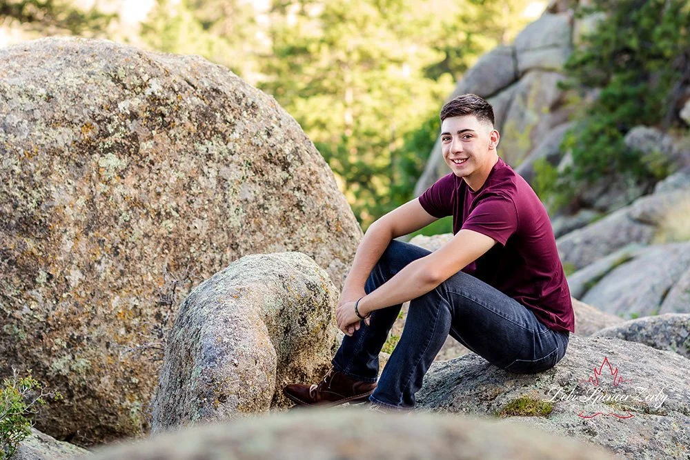 Senior in a tranquil outdoor setting for high school portrait.