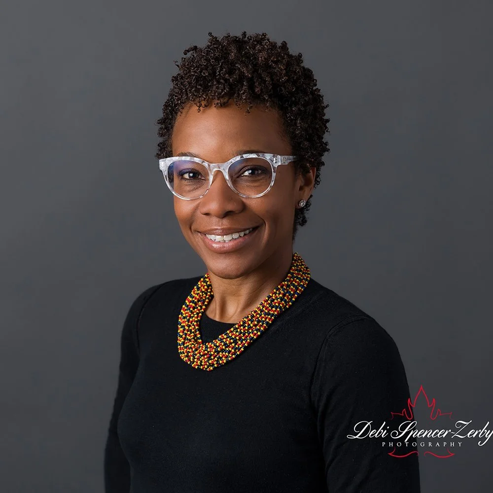 Professional studio portrait with a clean backdrop.