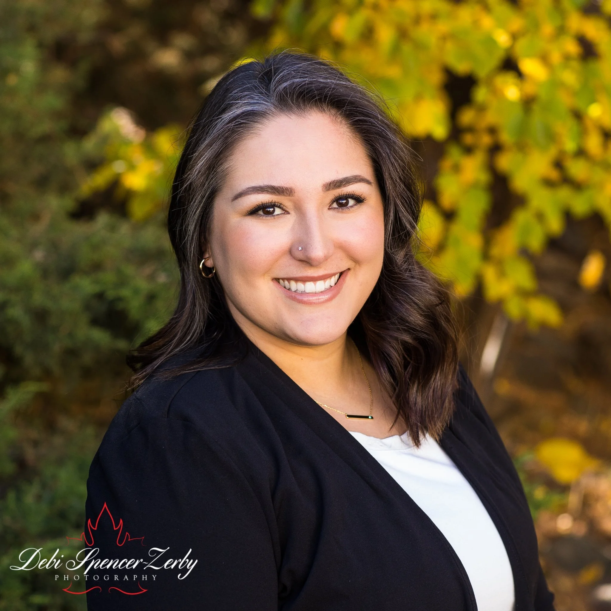 Professional outdoors headshot.
