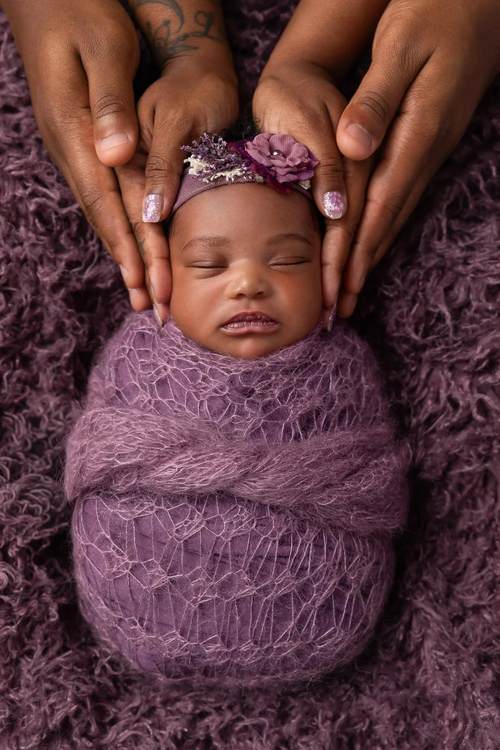 Sleeping Newborn baby in studio setting, posed adorably.