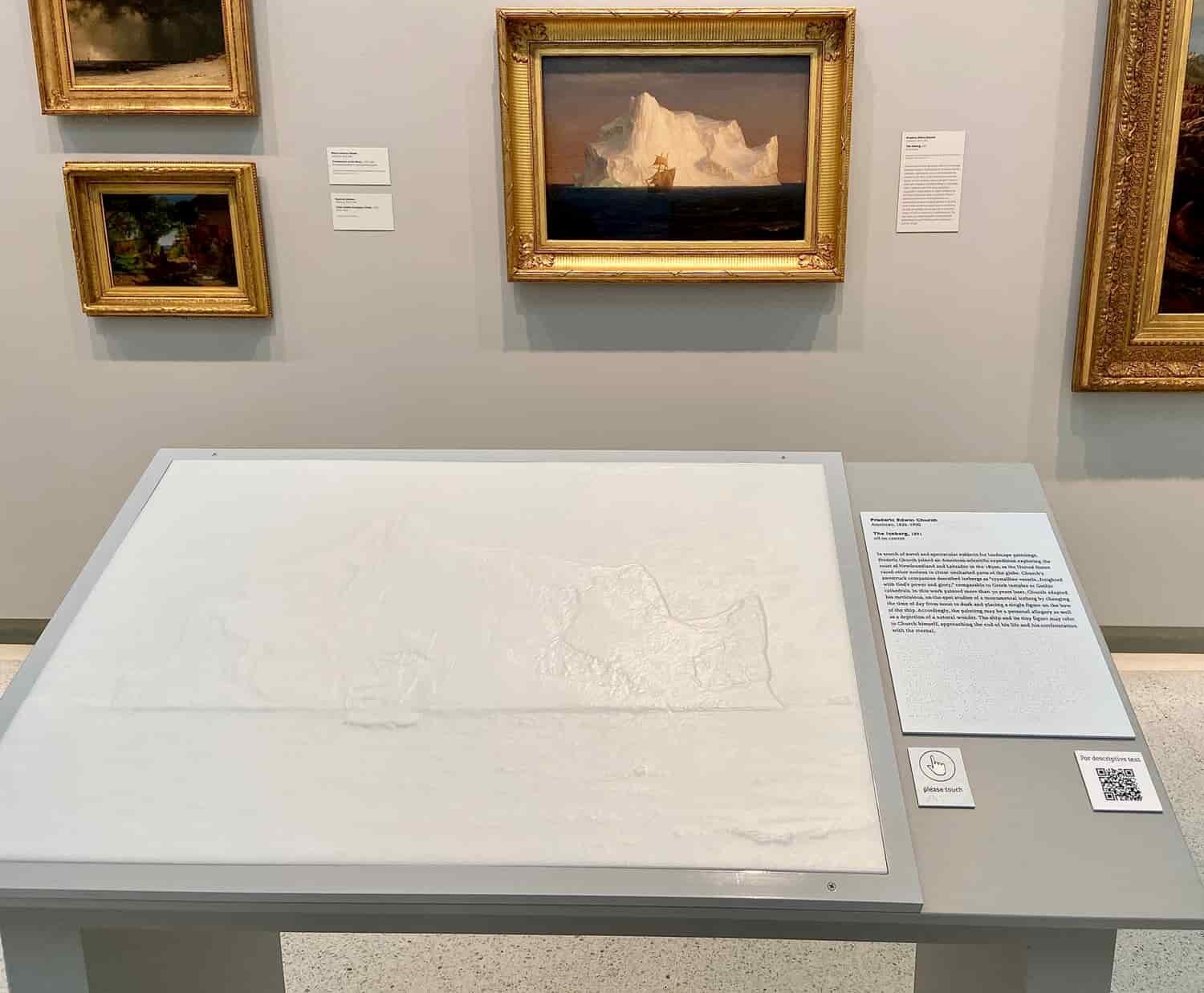  The Carnegie Museum of Art aims to make artworks accessible to everyone. Here, a tactile replica of the painting hanging on the wall can be seen. The replicas encourage people with visual impairments to engage with art. 