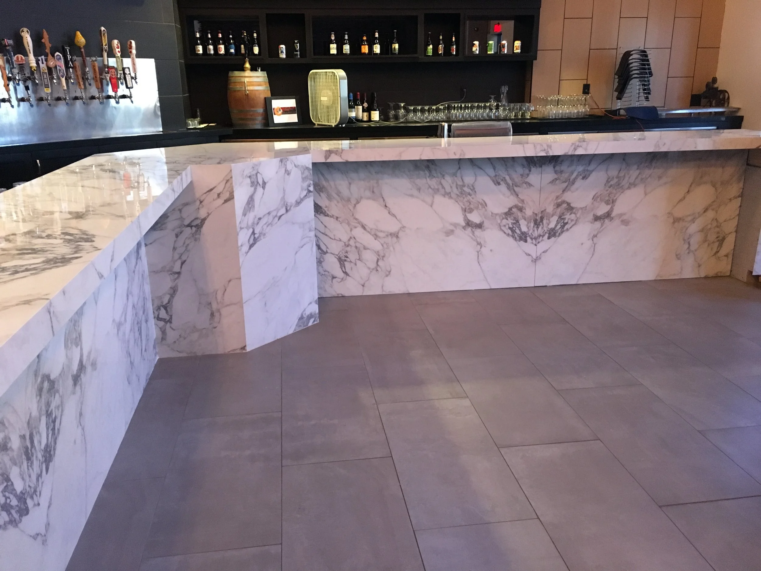  Porcelain wrapped countertop using Arabescato book match 
