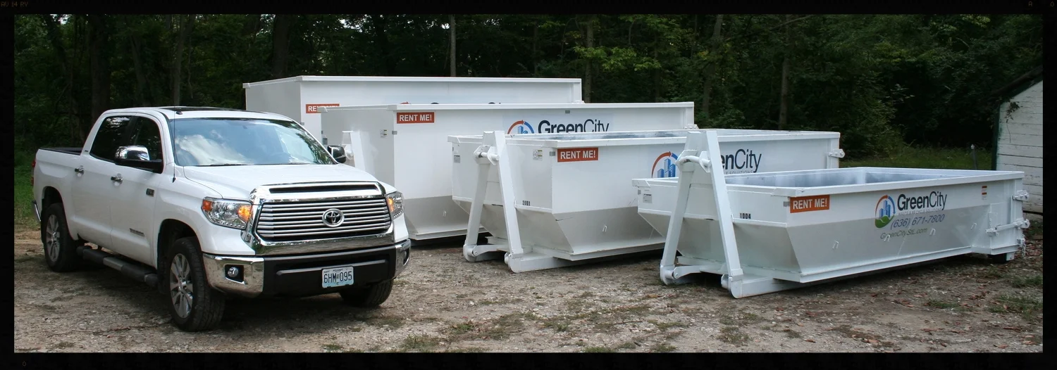 Dumpster sizes compared to a full size pickup truck.