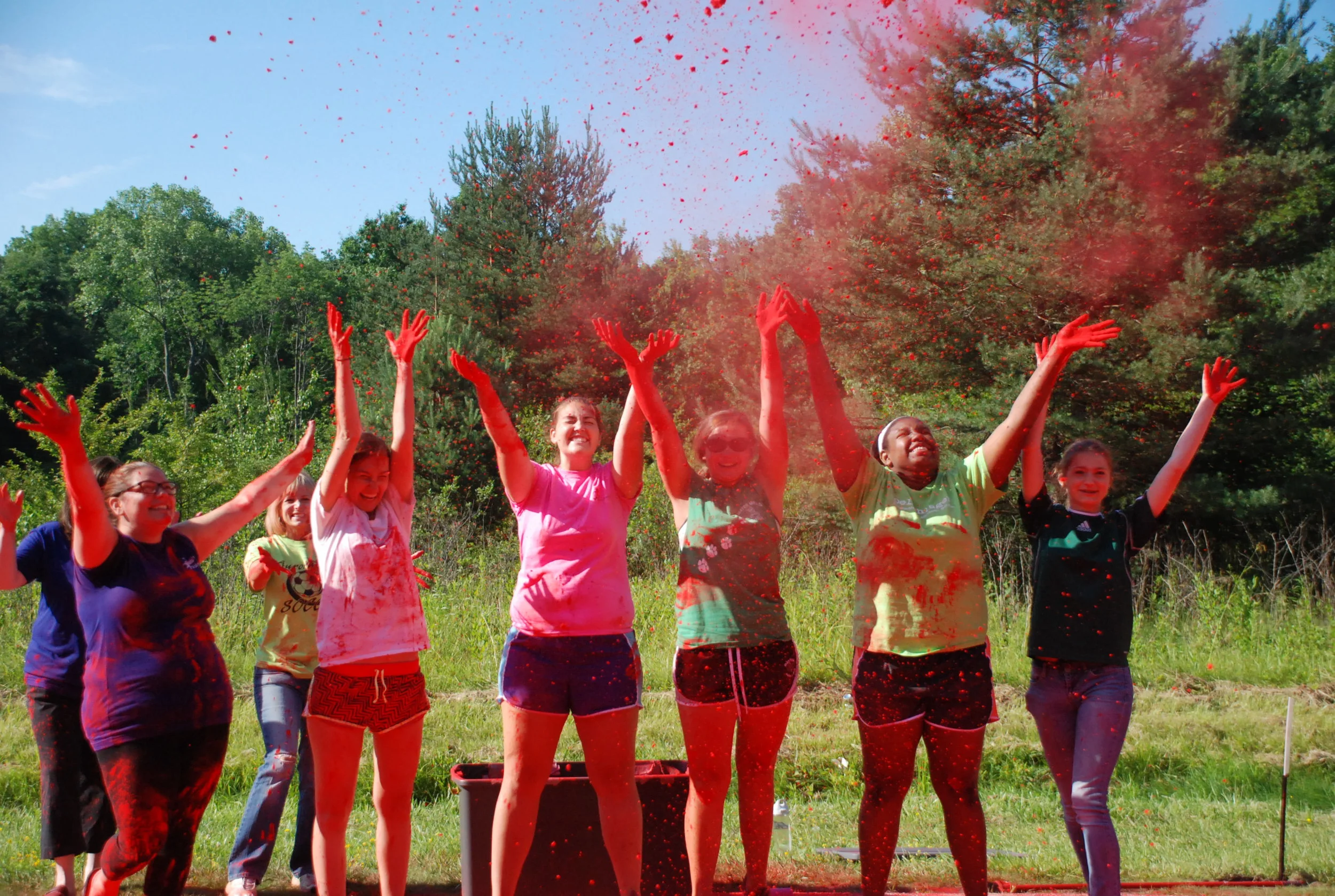 Our volunteers always have a great time! whether its color throwing (shown above), registration or being a water stop helper, they always have a smile on their face!