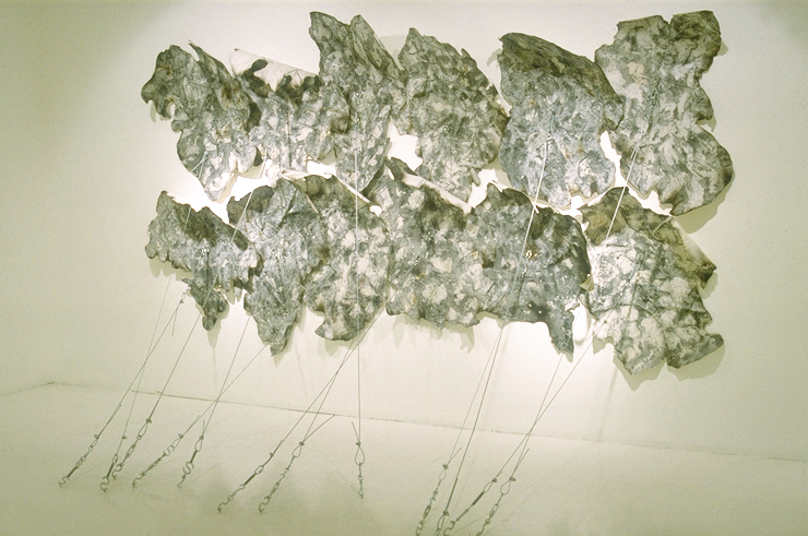 "The Rites of Science (ii) Communication (Large Scale Irregularity)" 93" x 146" x 72"; Science papers, charcoal, gauze, paper, molding paste, hardware, sewing, burning; 1995-96