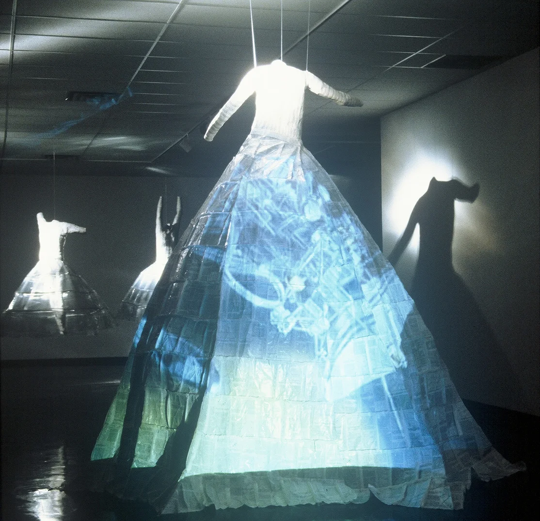 " A Marriage of Art and Science" DVD Installation: 2 video projectors, 3 body casts, sewn science papers; 2001 - 03