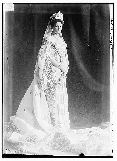 Empress Alexandra in a massive Imperial tiara of diamonds and pearls by Bolin, and a heavily embroidered court gown. the collar of true Order of St. Andrew, and the scarlet ribbon of the Order of St. Catherine. This same dress is shown below.