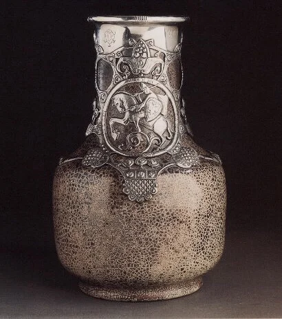 A Fabergé silver-mounted cEramiC vase by the StroganofF school, ca 1901. Sold christie’s New york, april 18, 1996.