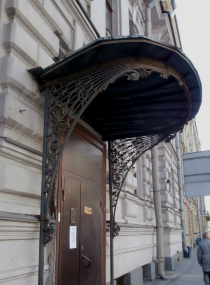 A view of the 1910-1911 cast and wrought-iron door canopy in the art nouveau taste