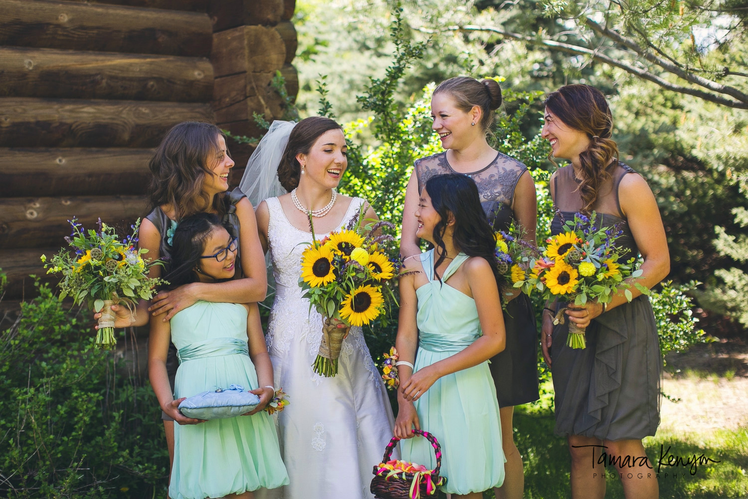 bride and bridesmaids laughing boise wedding photographer