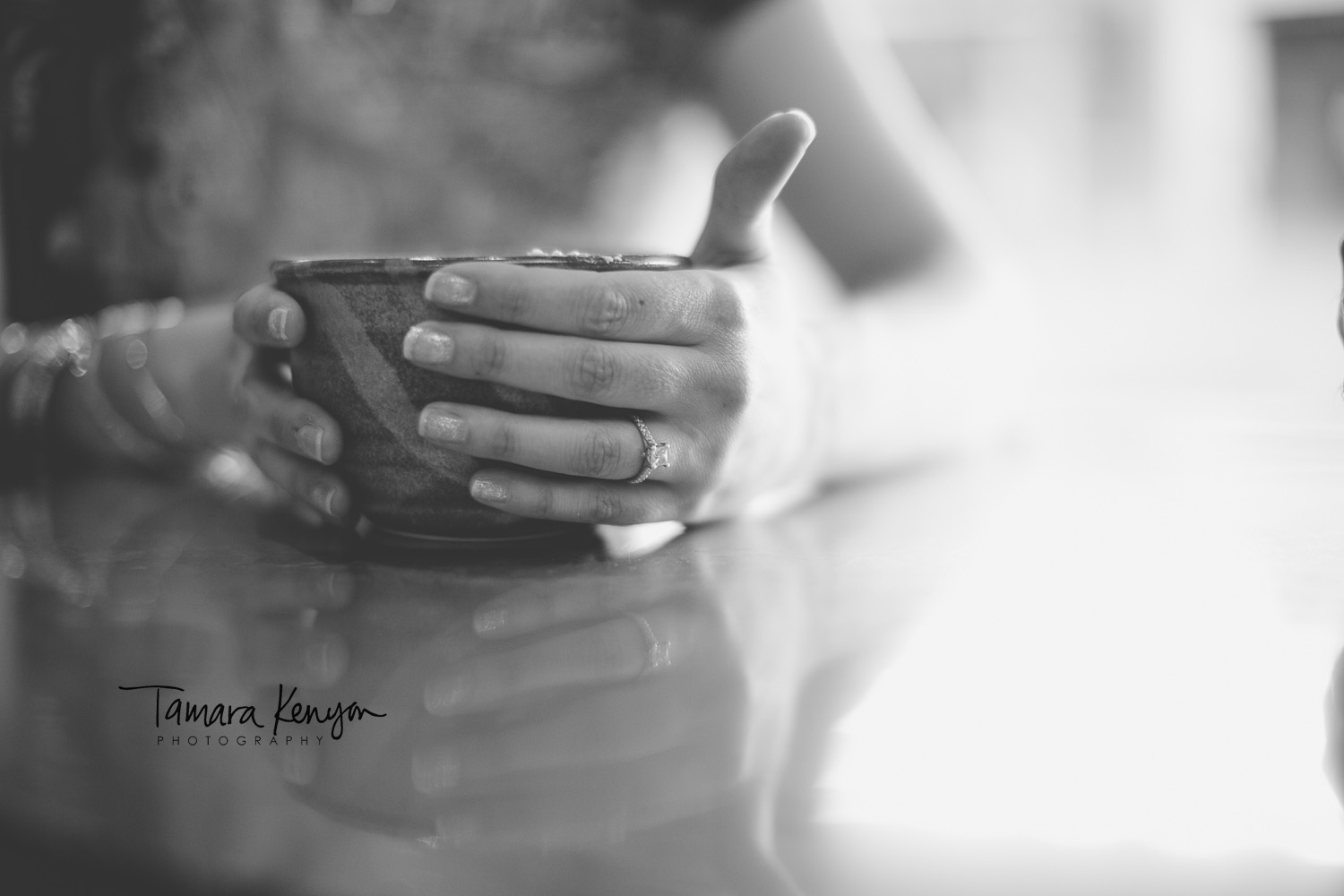 engagement ring and coffee cup