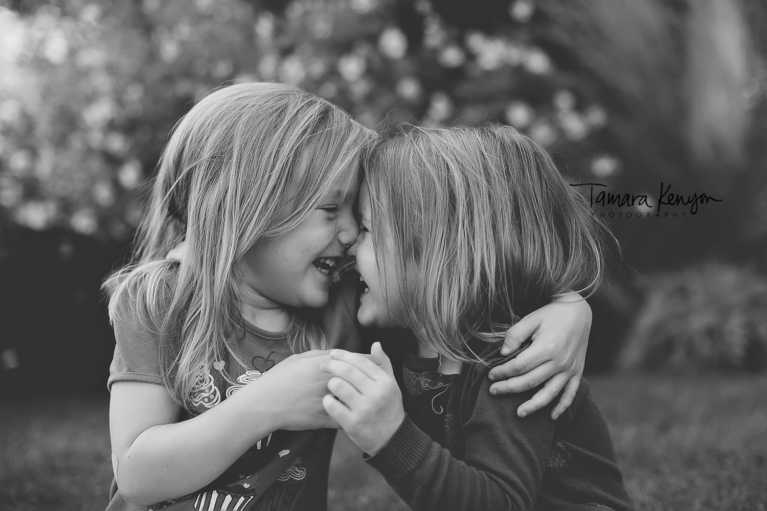 sisters laughing together