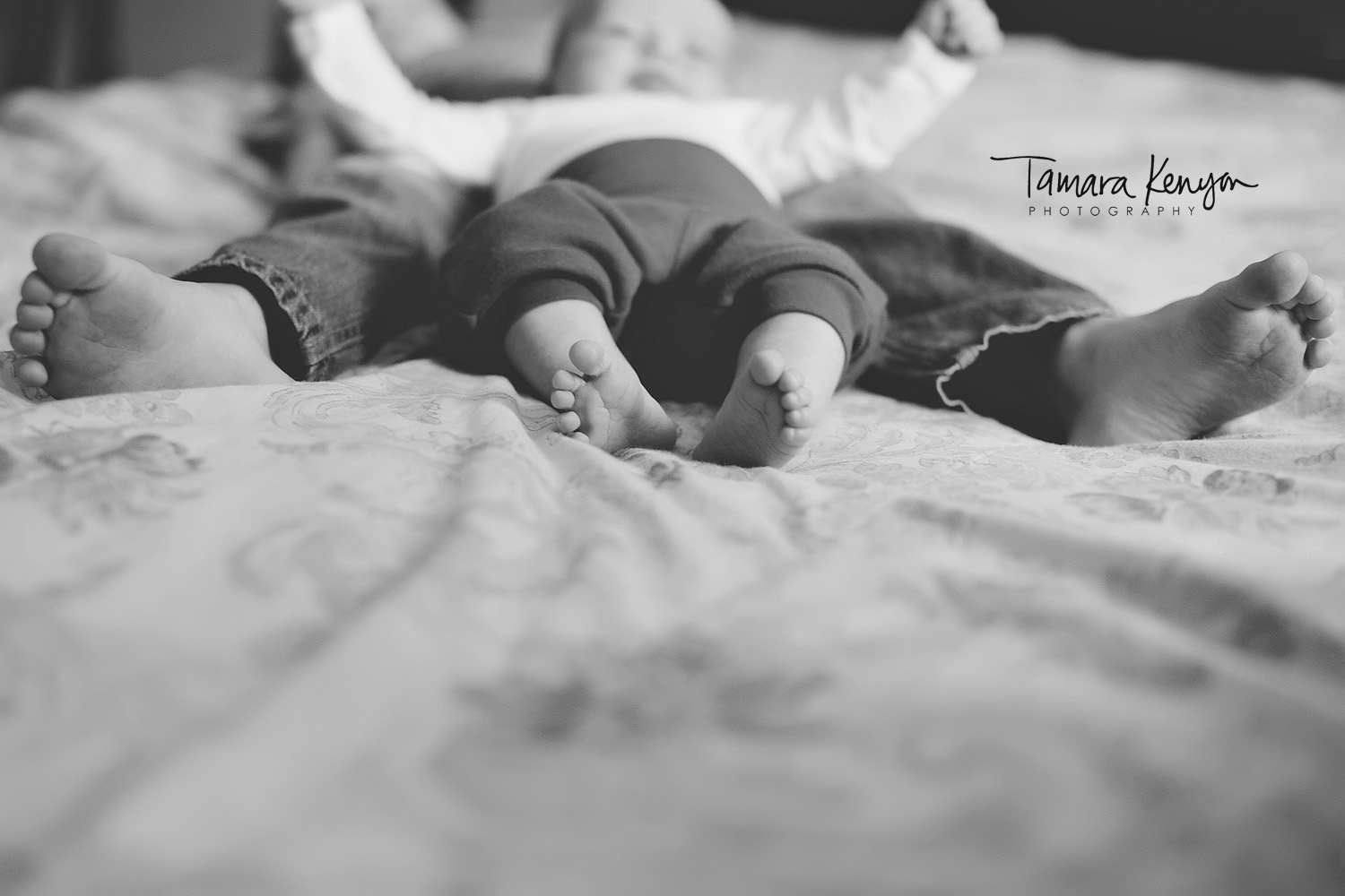 baby and sibling feet