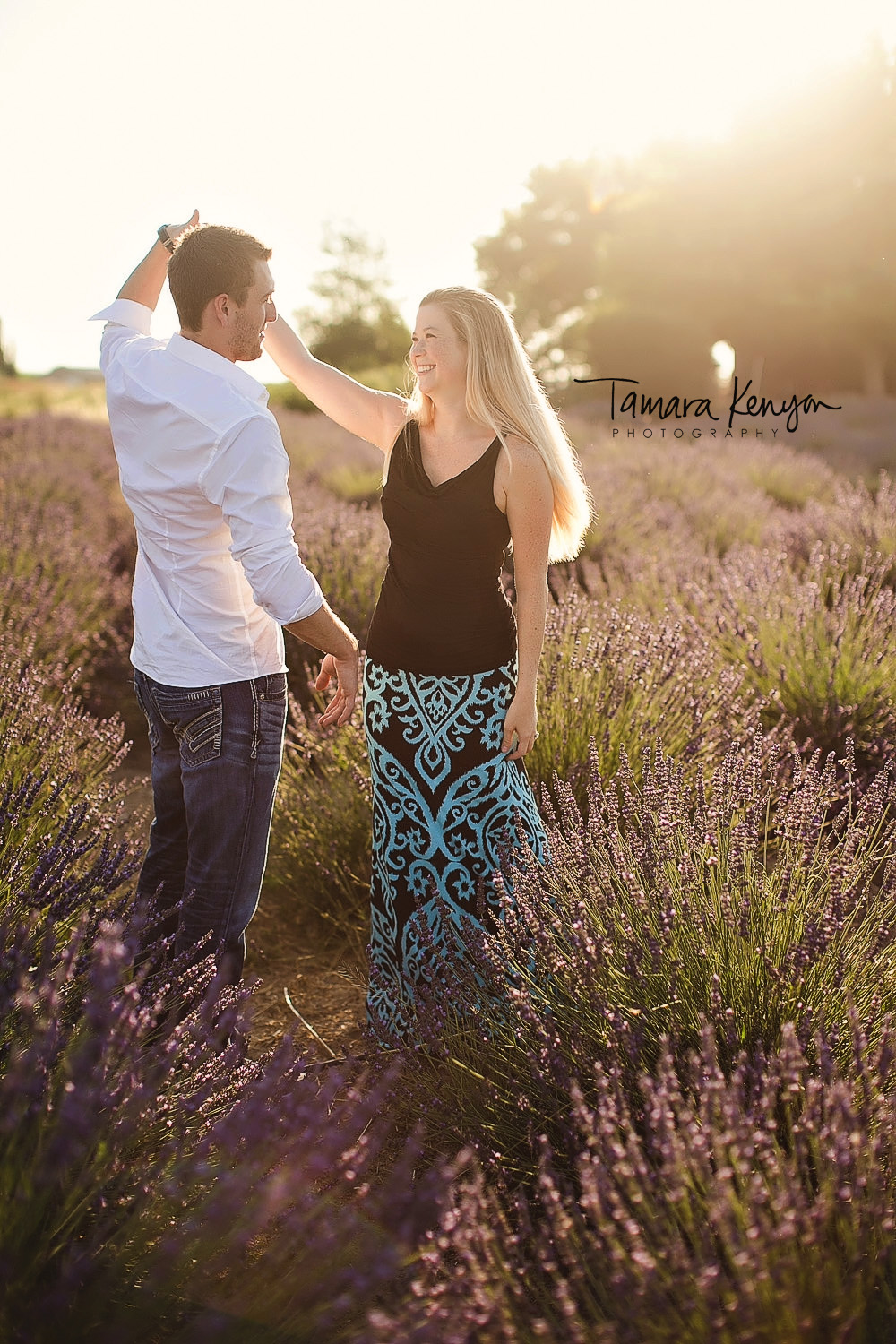dancing in a field of flowers boise engagement