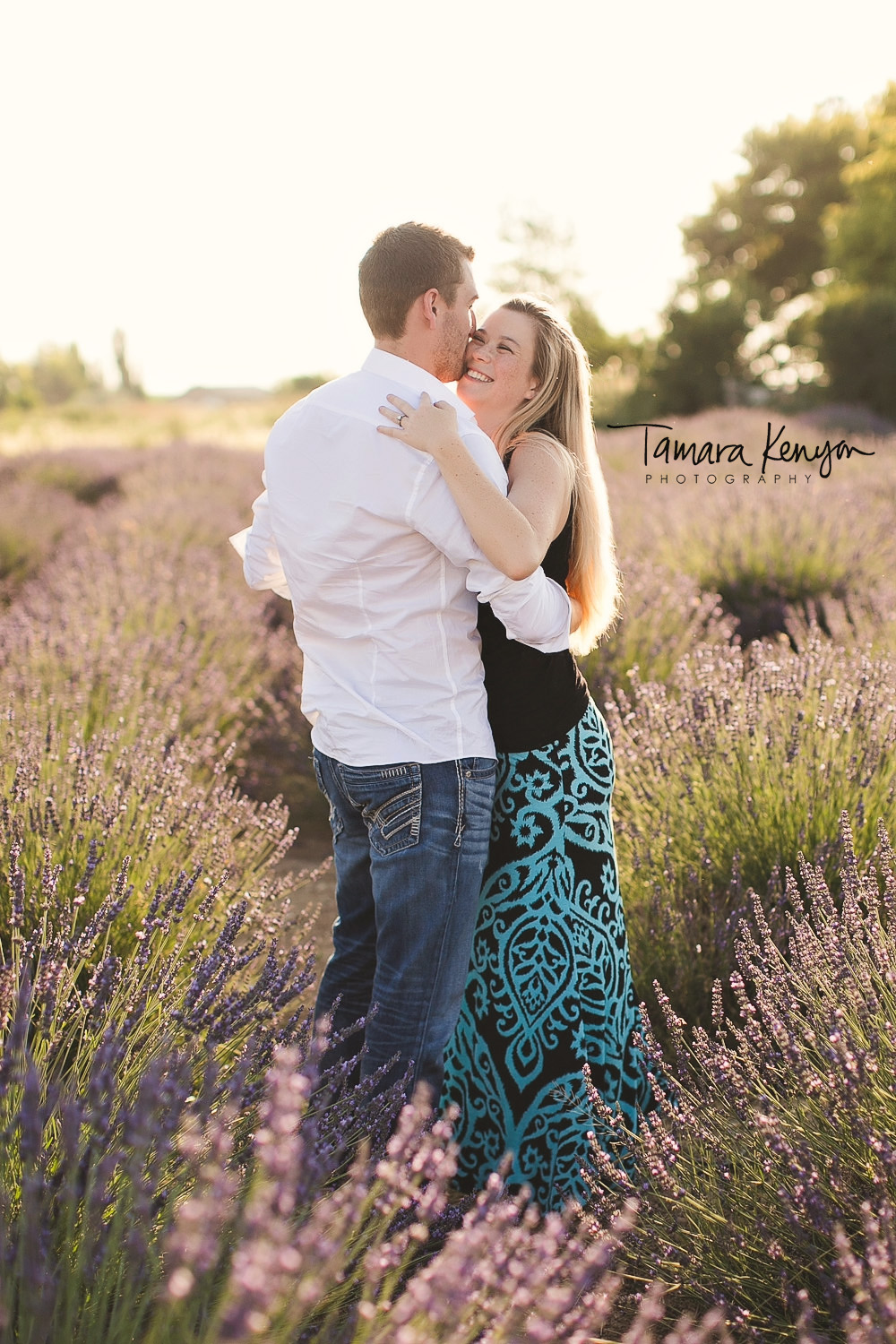 engagement photos in a field of flowers boise