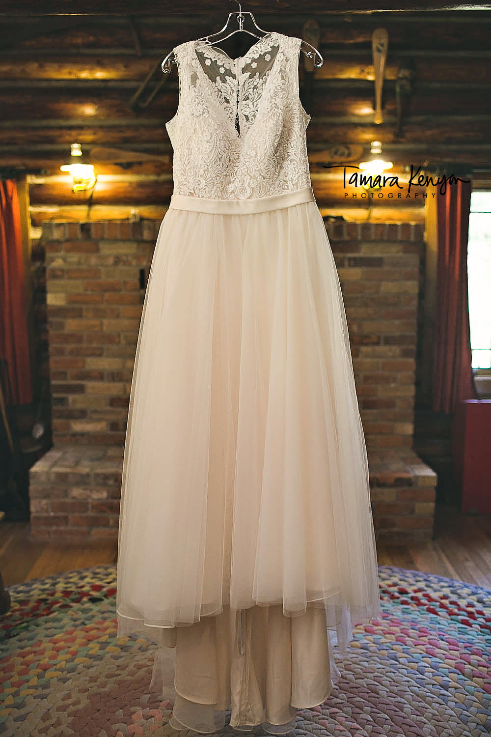 wedding dress hanging in a cabin