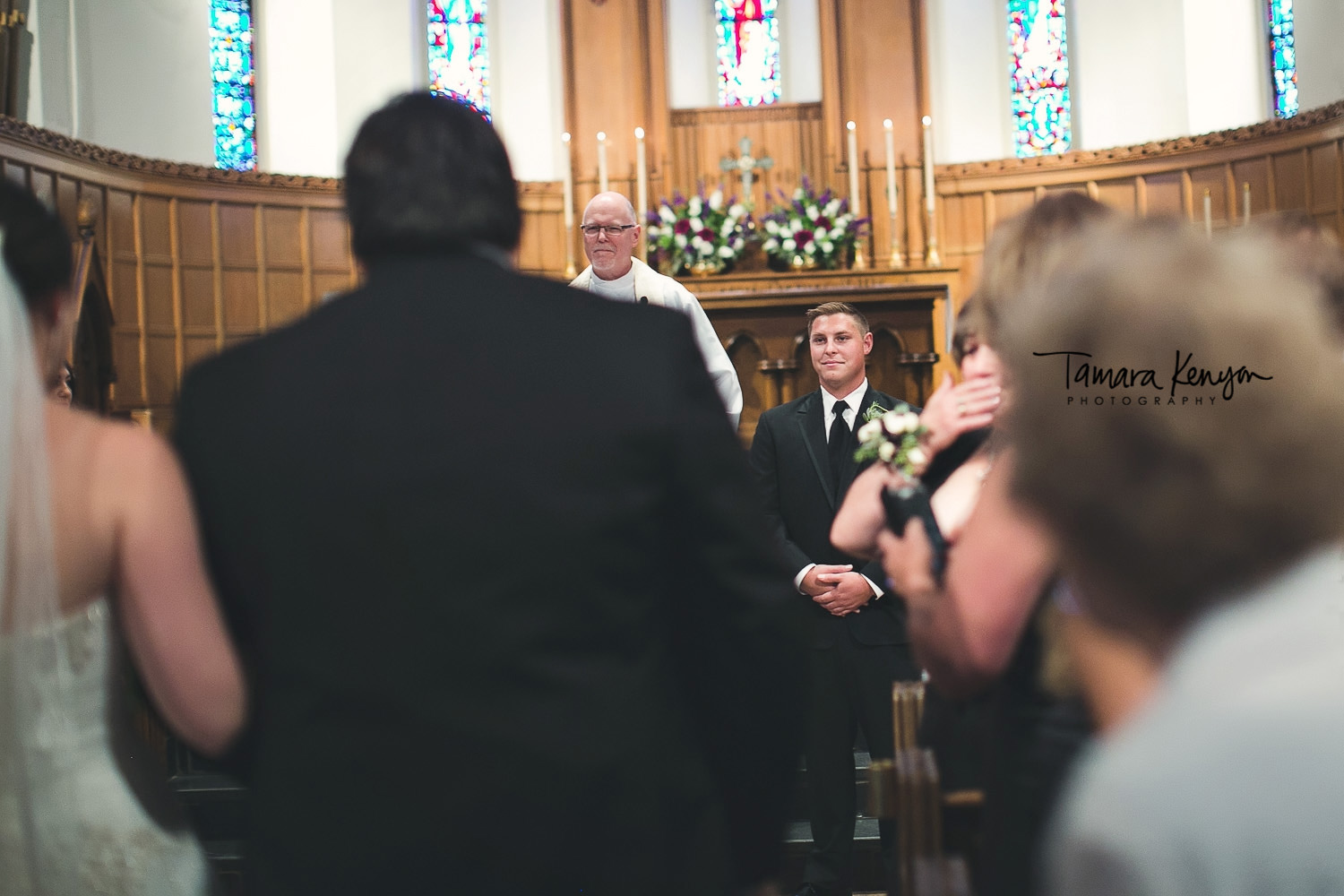 groom seeing his bride in church
