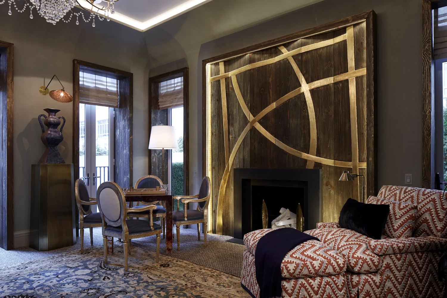 Embossed gold leaf fire place surround finished by Osmundo Studio for David Kleinberg