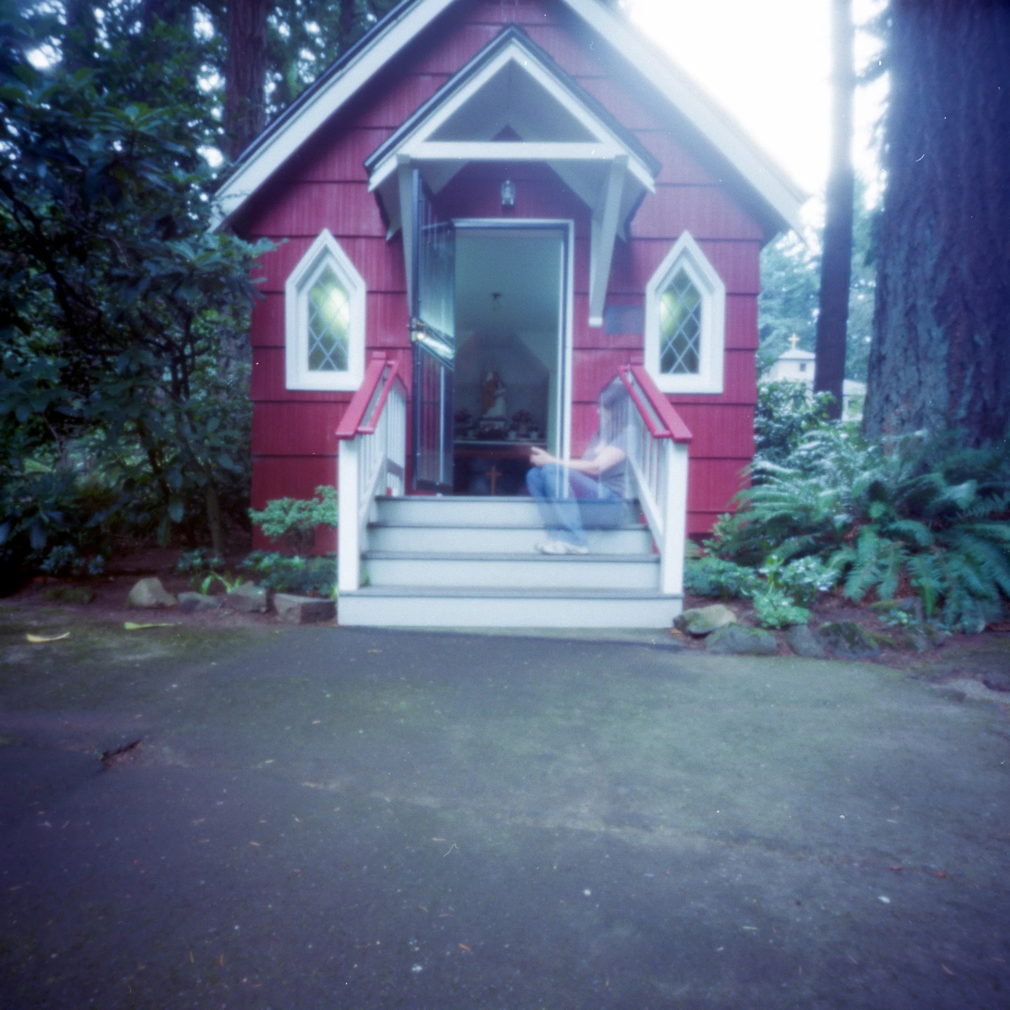On the steps of the red chapel. 