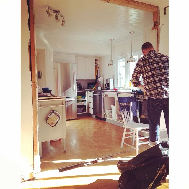 Action shot of Chris hard at work. The wall is gone! The "in progress" view from the dining room to the kitchen. 