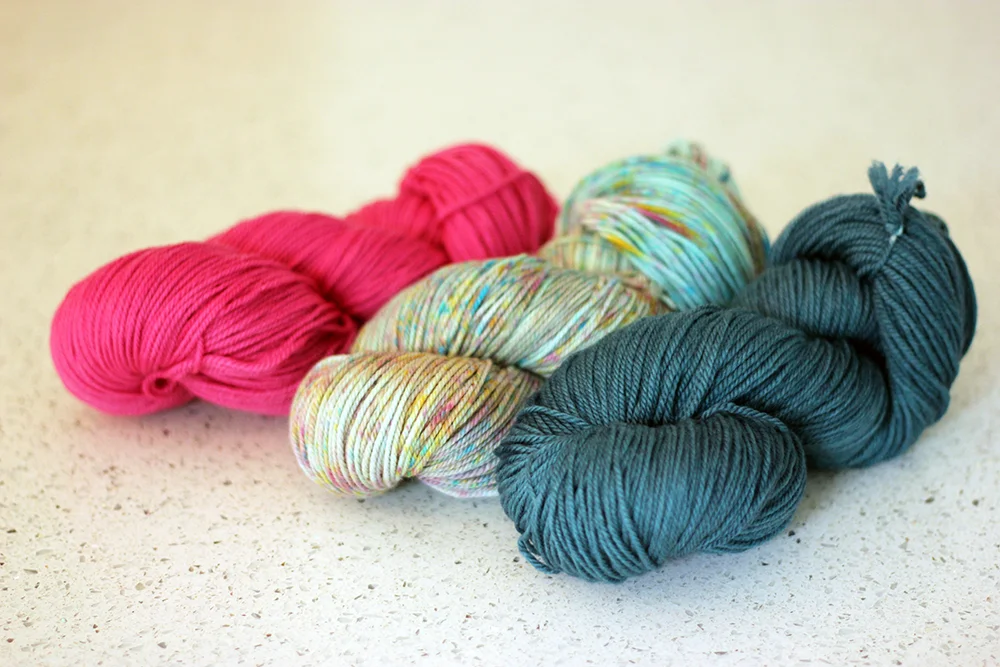 TFA PureWash DK in colour ways: Orchid, Hummingbird and Ravine.