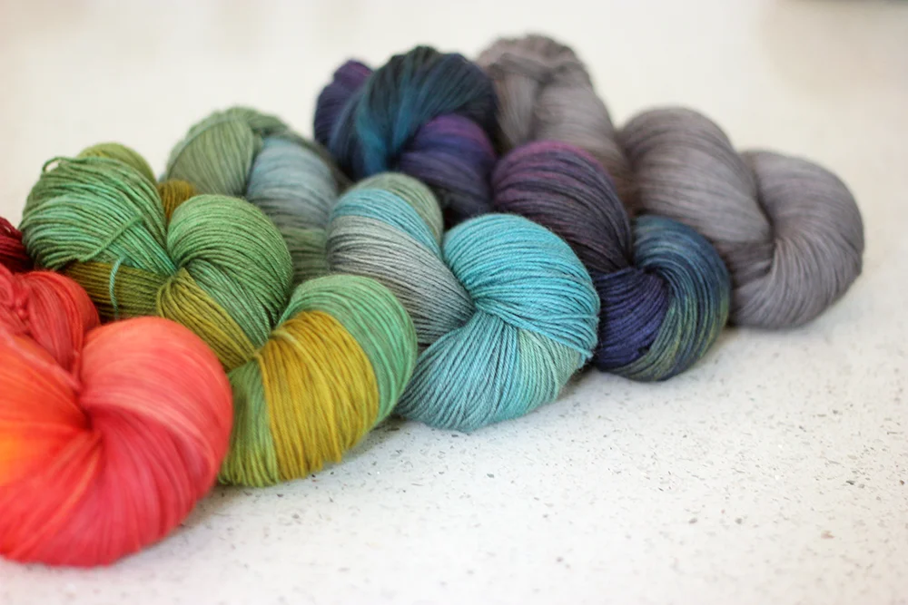 PureWash Fingering in Sunday, Sprout, Lotus, Cosmic Night & Graphite.