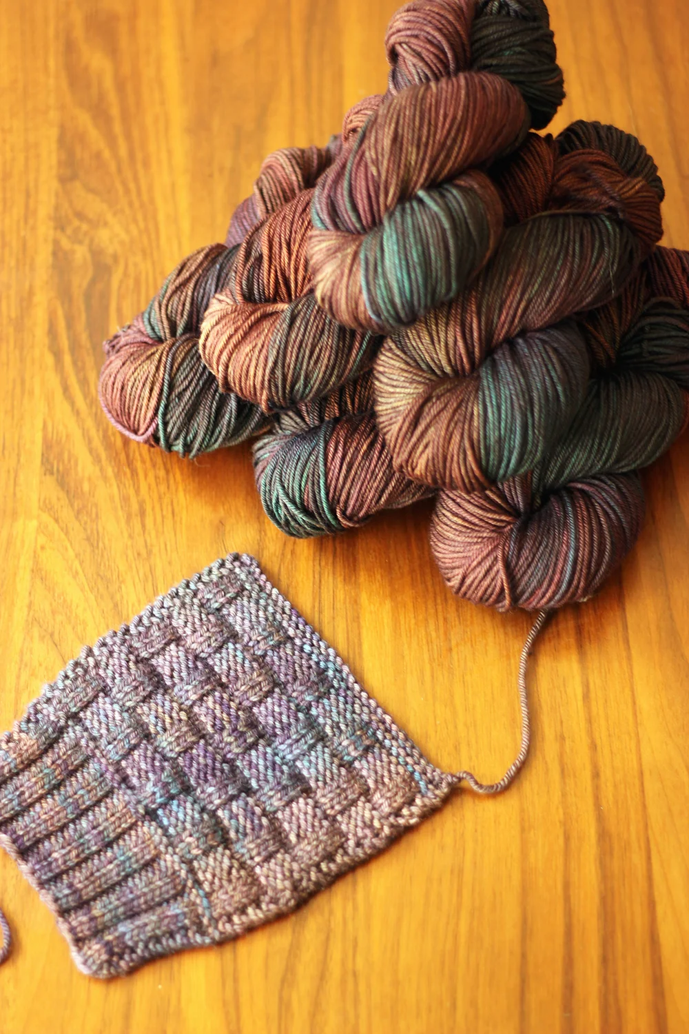 Just some yarn (TFA PureWash Worsted in Tartan) and a swatch (not knit in Tartan...) for some stimulating visual content to an otherwise very wordy blog post!