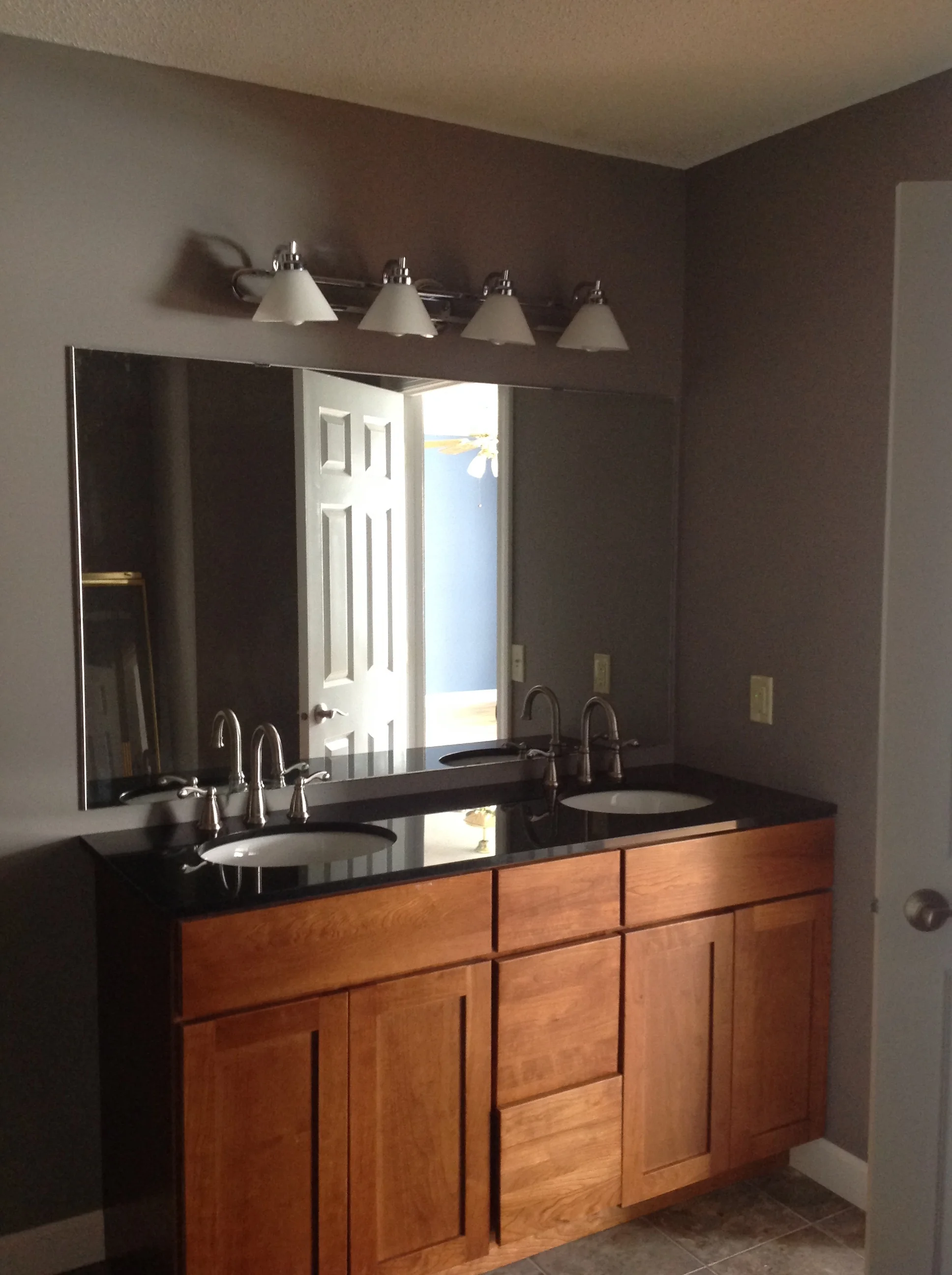 Main bath includes double sink and tile floor with shower/tub. 