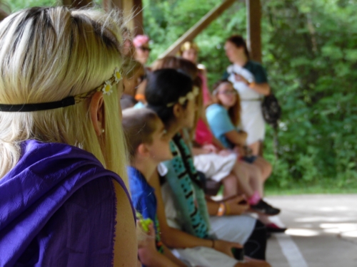 Kids at MDA Summer Camp wait for their turn on the archery and riflery range