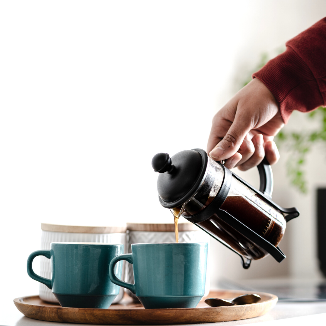 hand pouring from French press