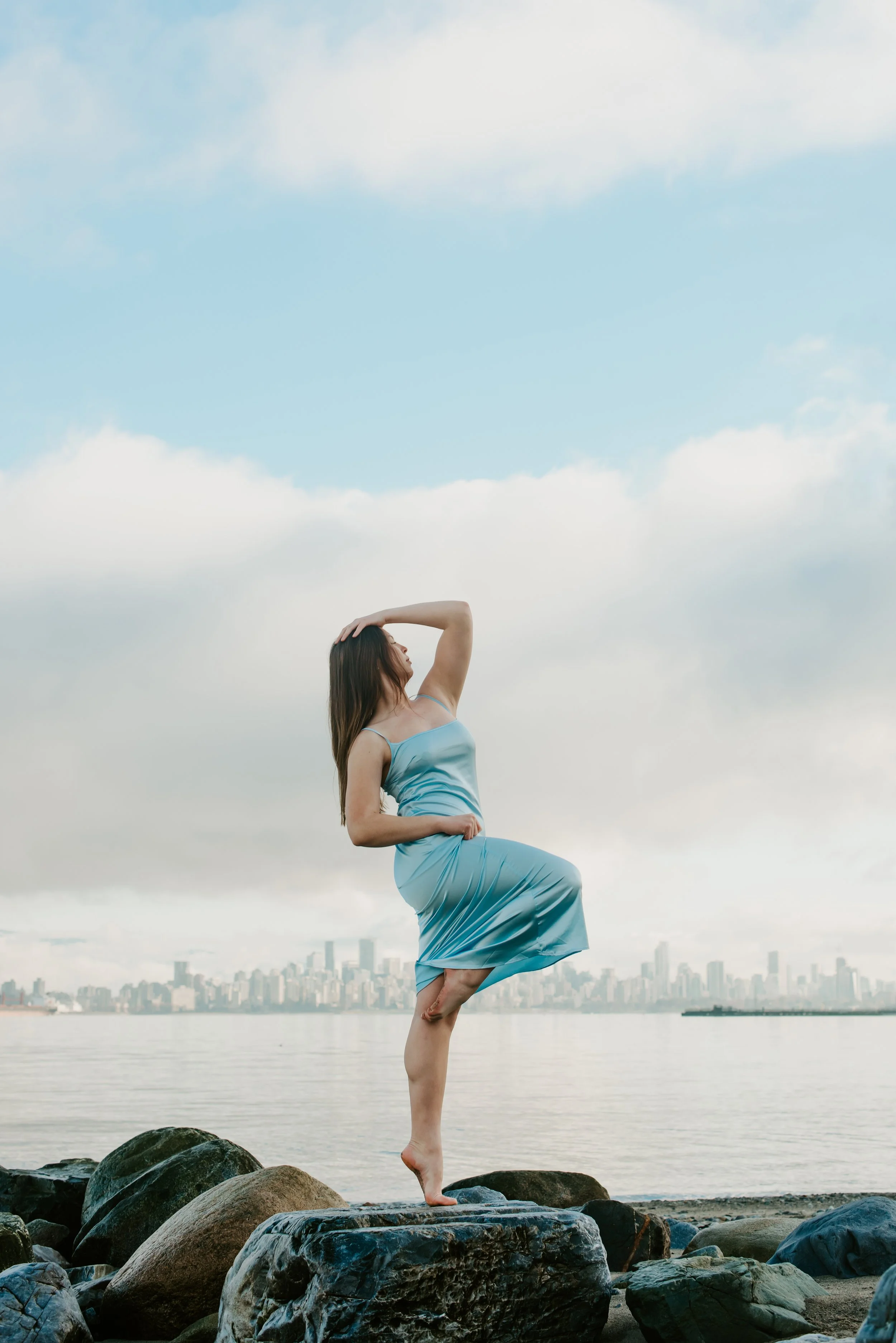 dancer-on-rocks-blue-sky-dress.jpg