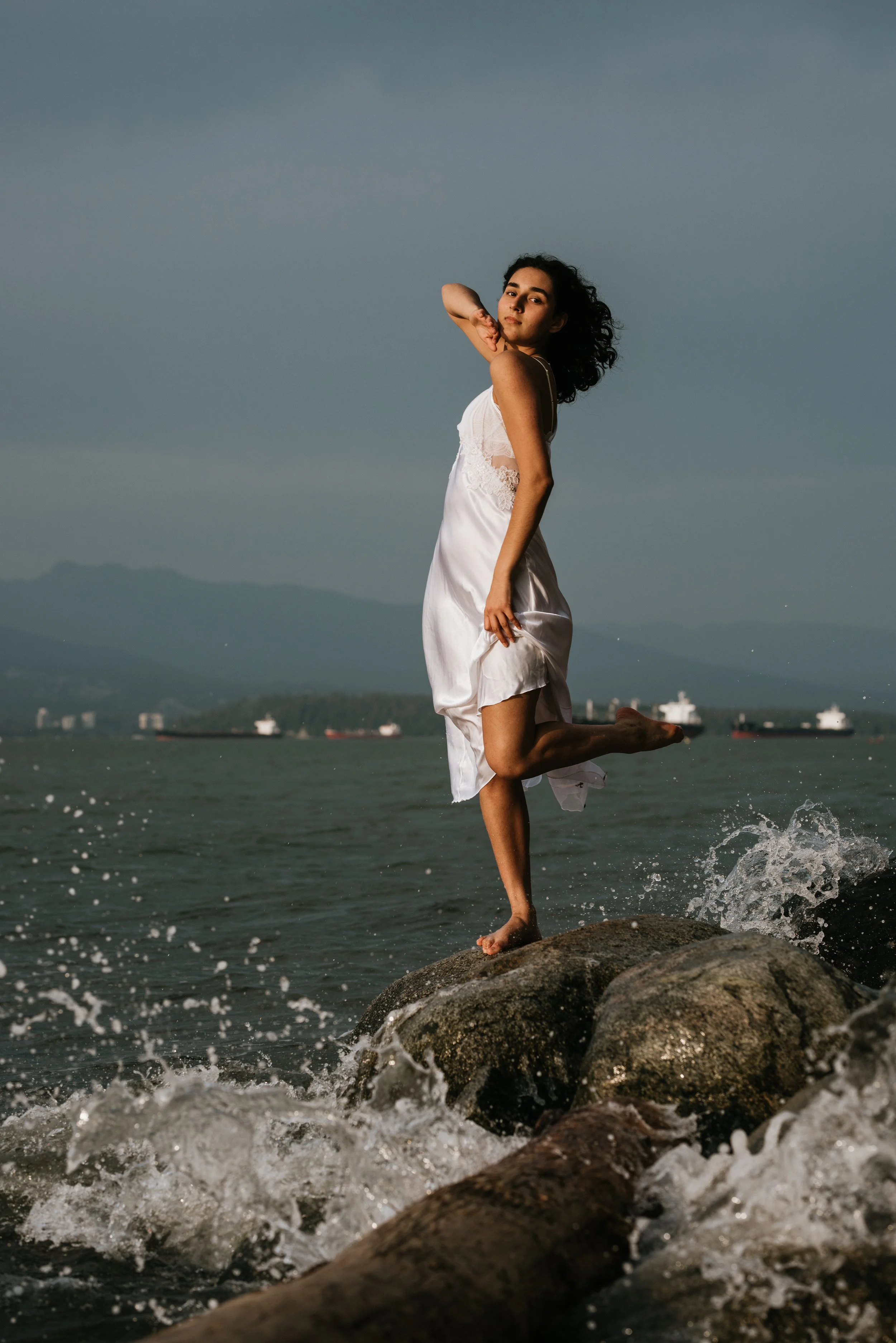 dancer-on-rocks-waves-crashing.jpg