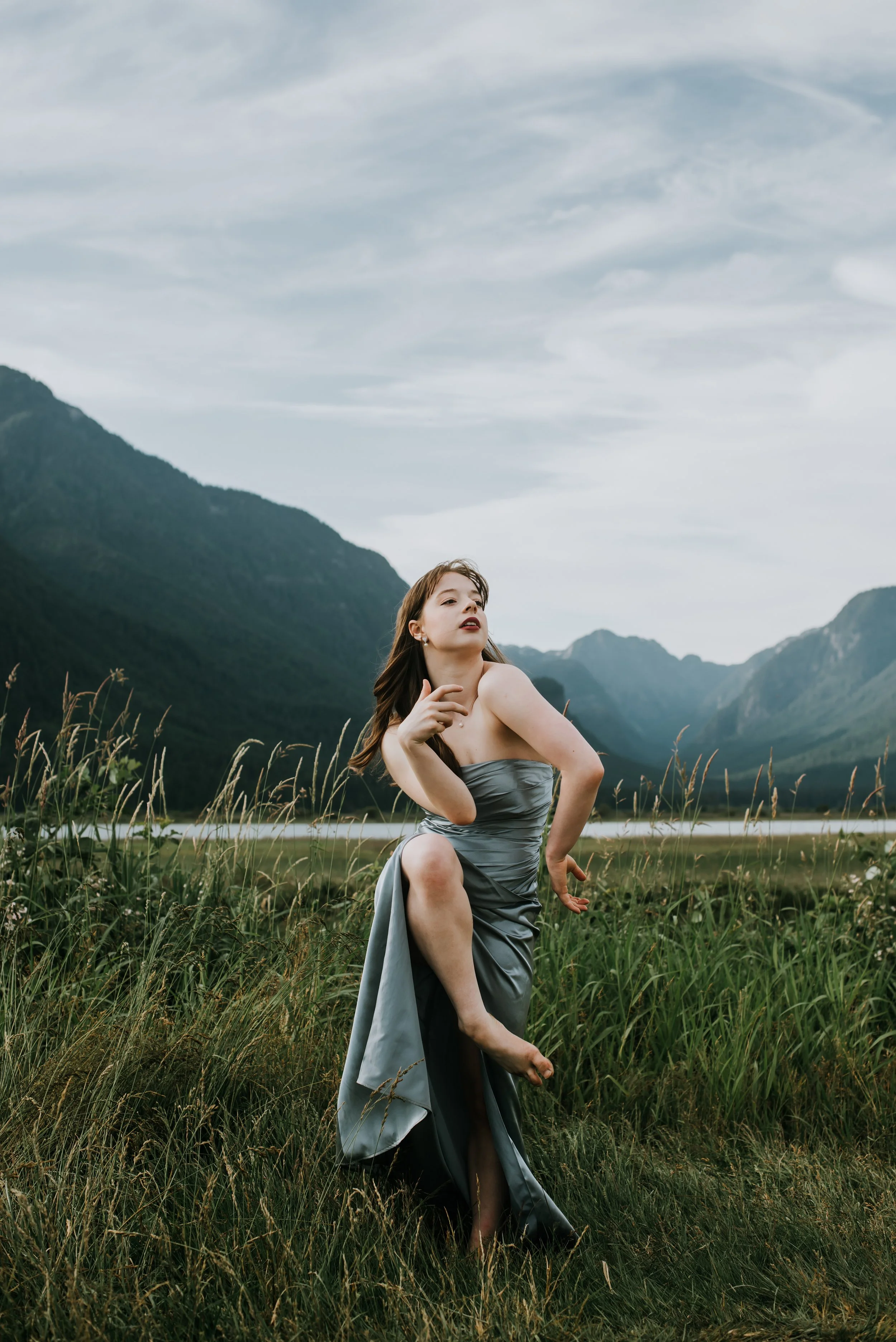blue-dress-dancer-field-mountain-backdrop.jpg