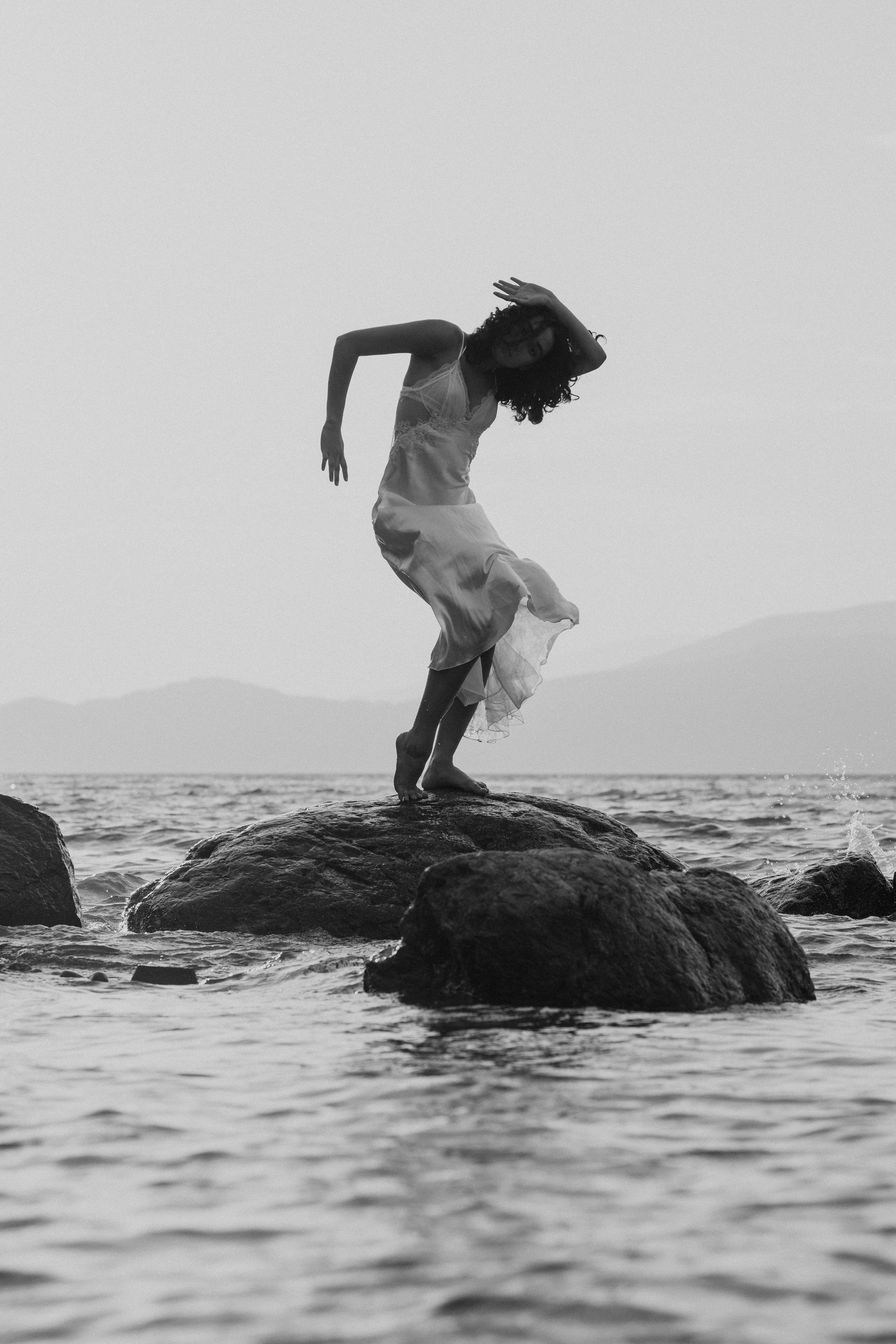dancer-on-rock-surrounded-by-water.jpg