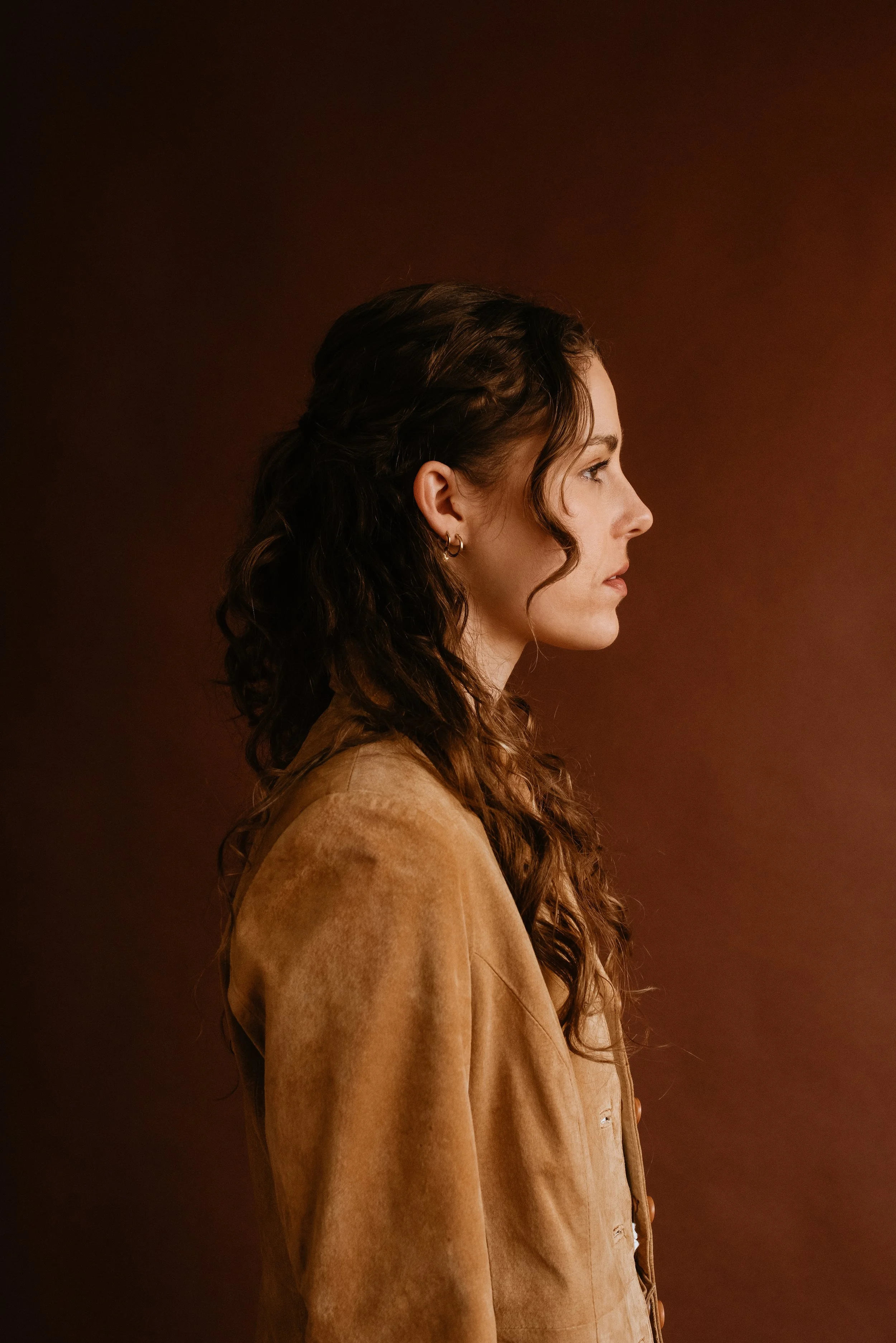side-profile-portrait-brown-backdrop.jpg