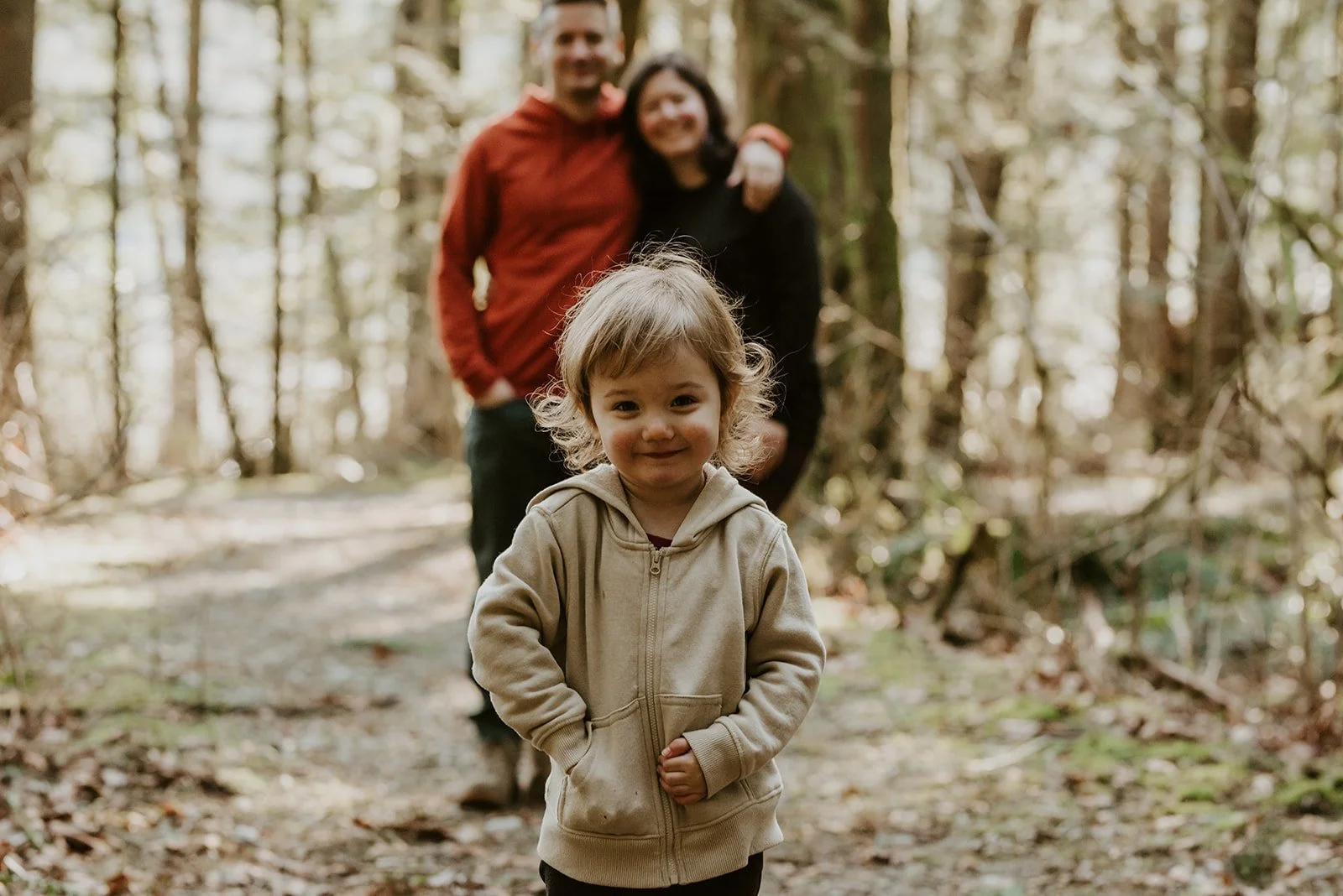 daughter-with-parents-standing-behind.jpg