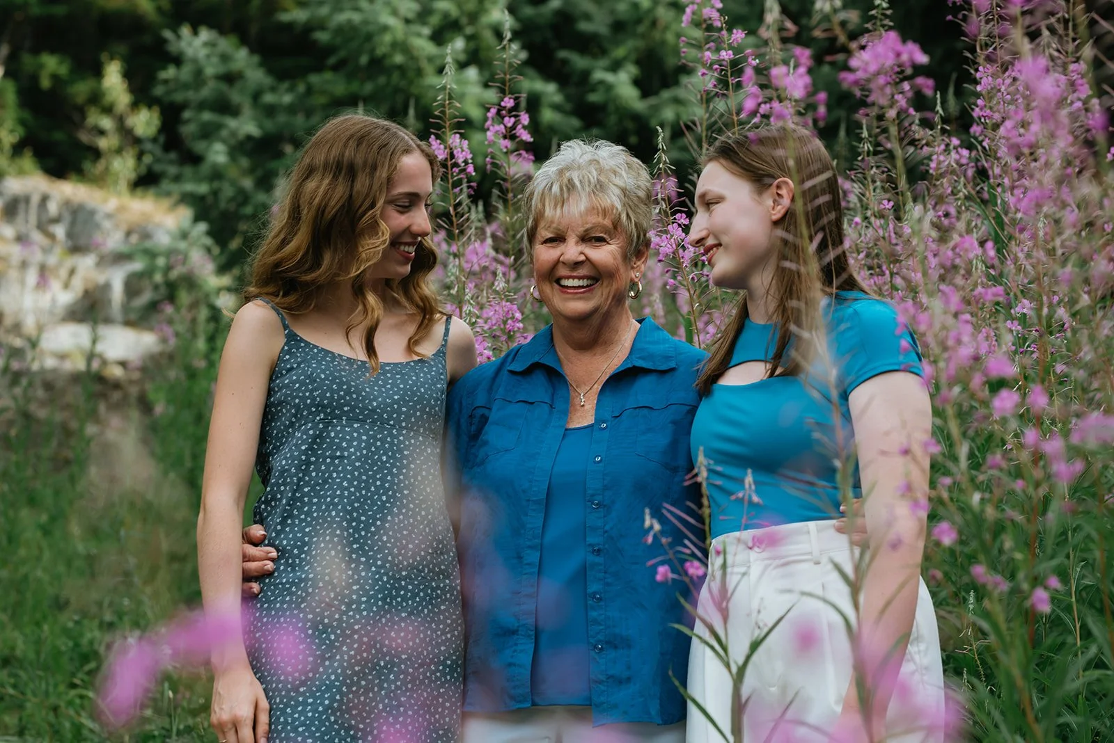 grandma-with-grandaughters-surrounded-by-flowers.jpg