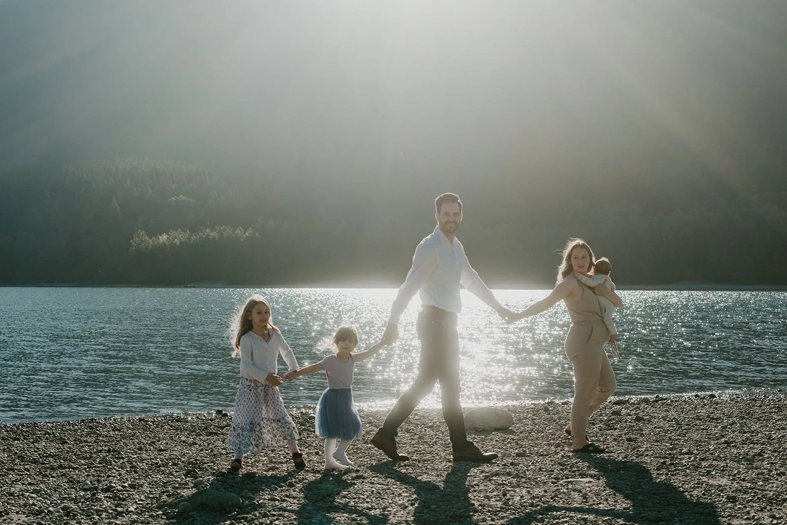 family-holding-hands-walking-sunrise.jpg