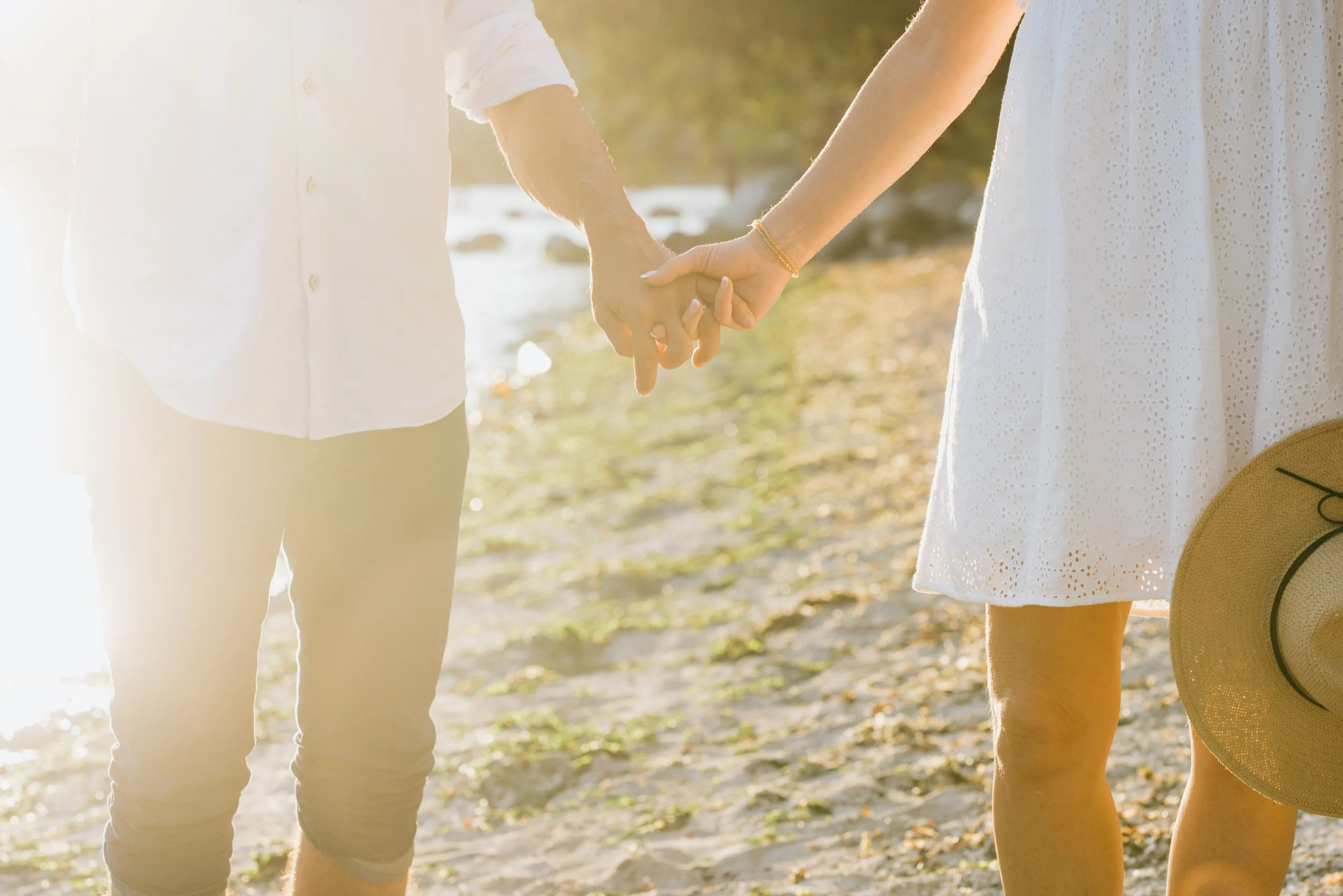 couple-holding-hands-sunset.jpg