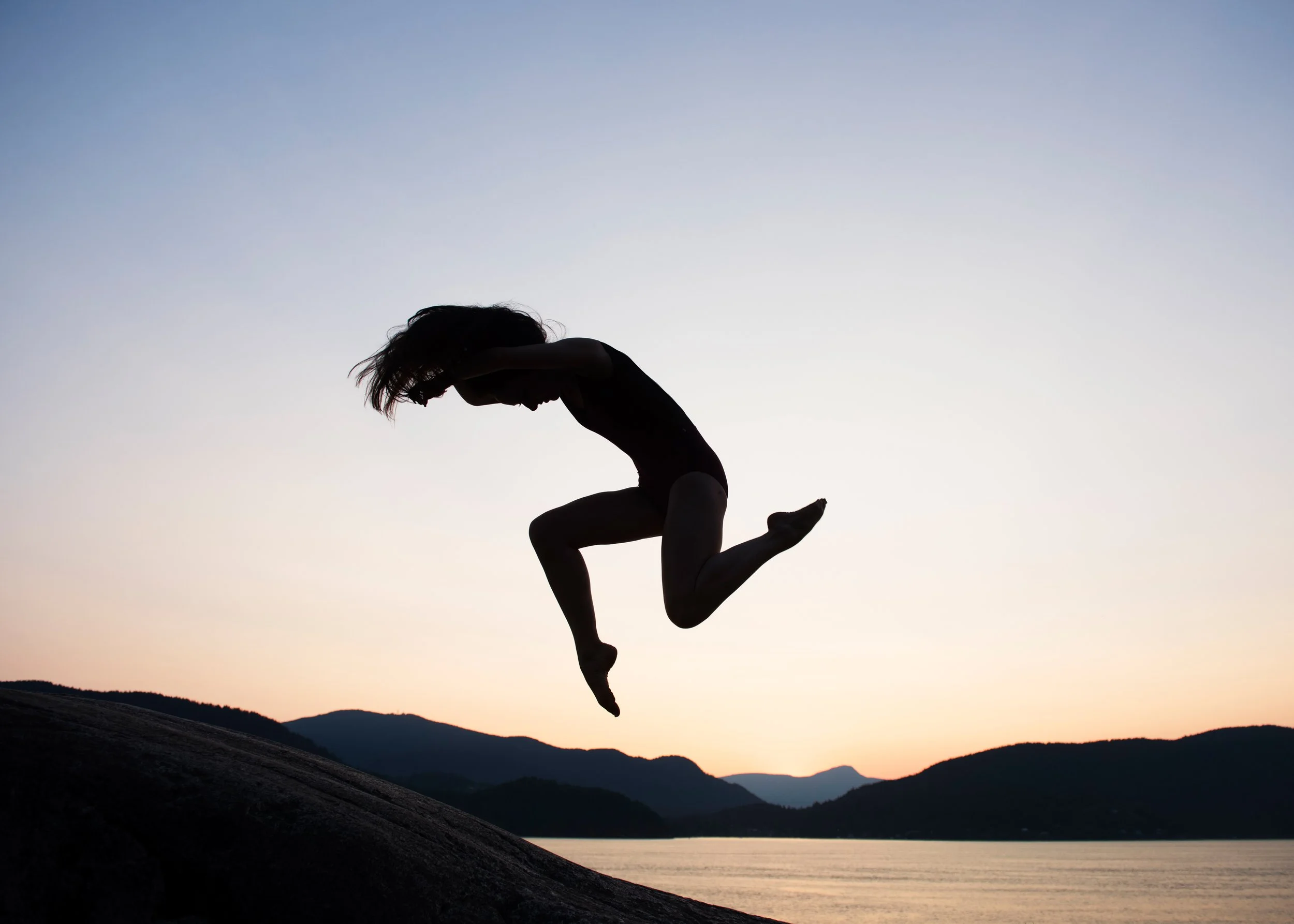 dancer-jumping-mountain-sunset-backdrop.jpg