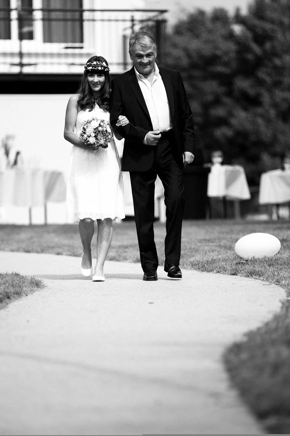 Father walking the bride down the aisle.
