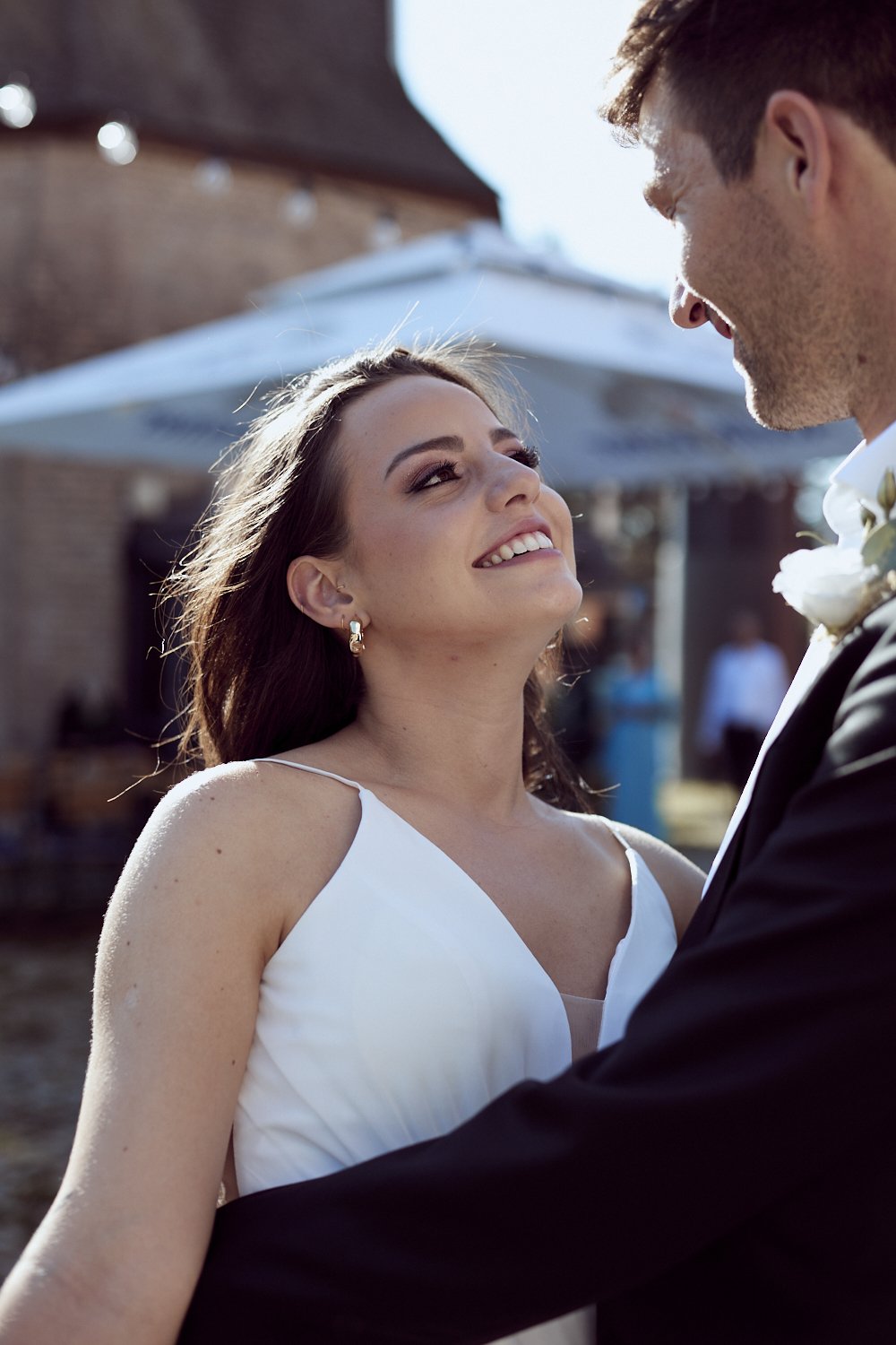 Bride staring into groom's eyes.