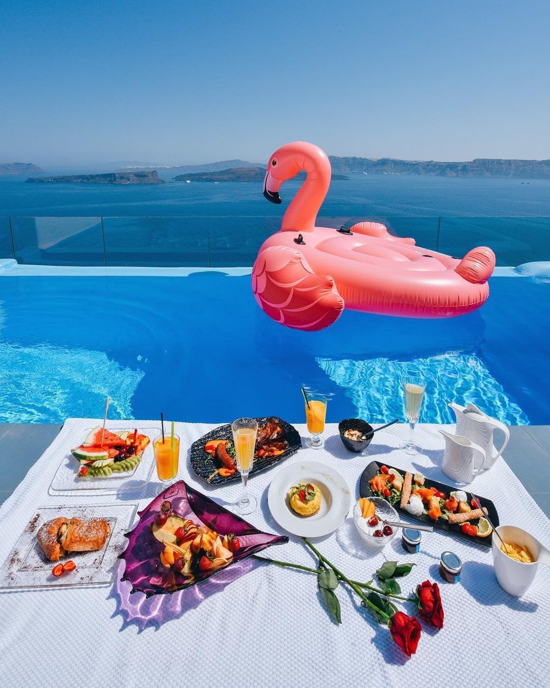 Breakfast poolside in Santorini island - Astarte Suites Luxury Hotel flamingo.JPG
