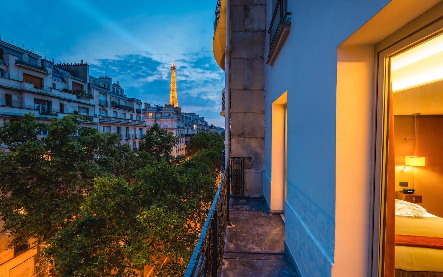Parisian balcony with Eiffel Tower View at dusk