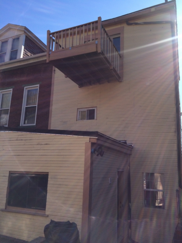 The balcony is now a Juliette balcony and all siding and windows are new.