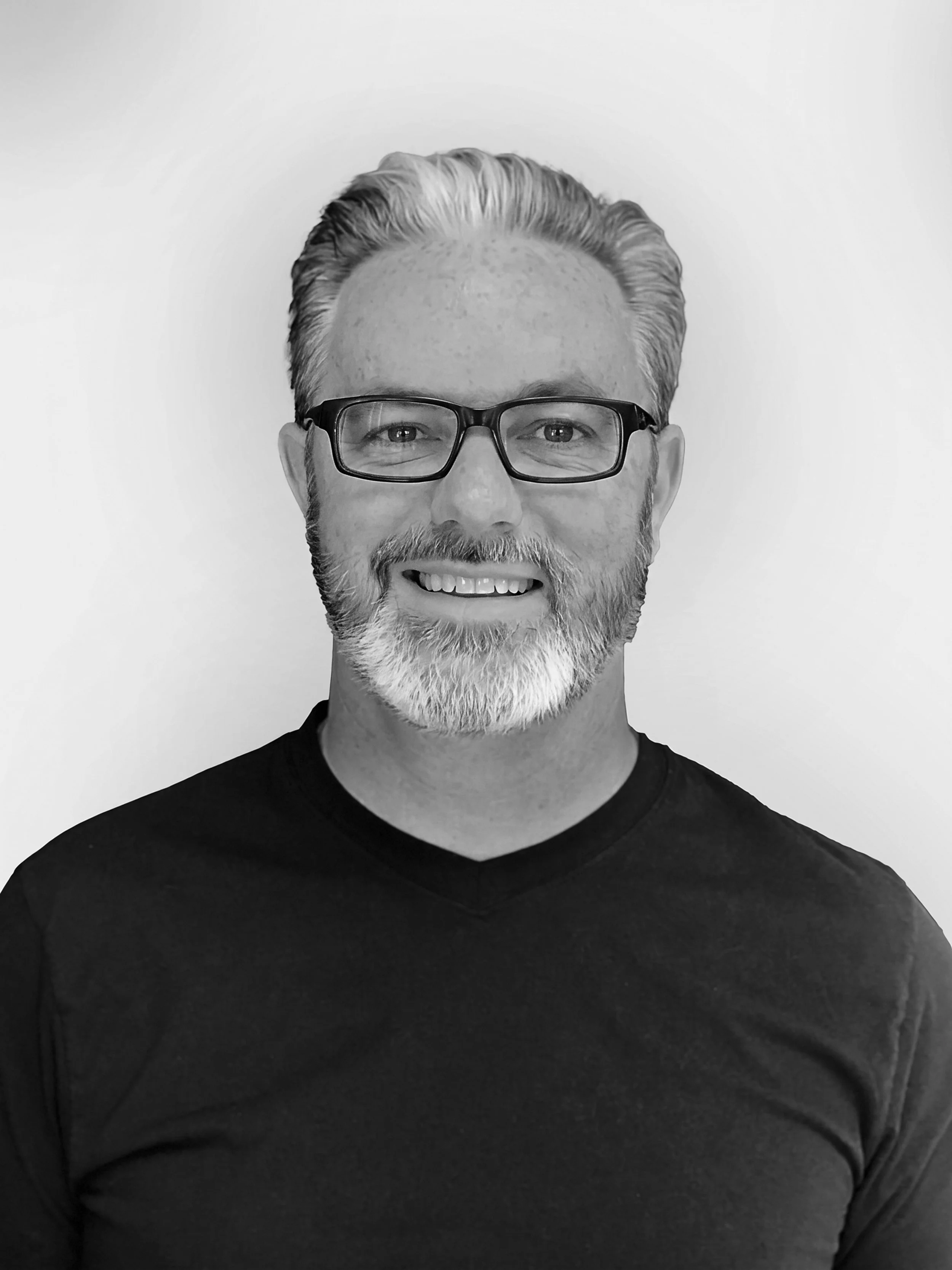 A black and white portrait of Erick Flatt.