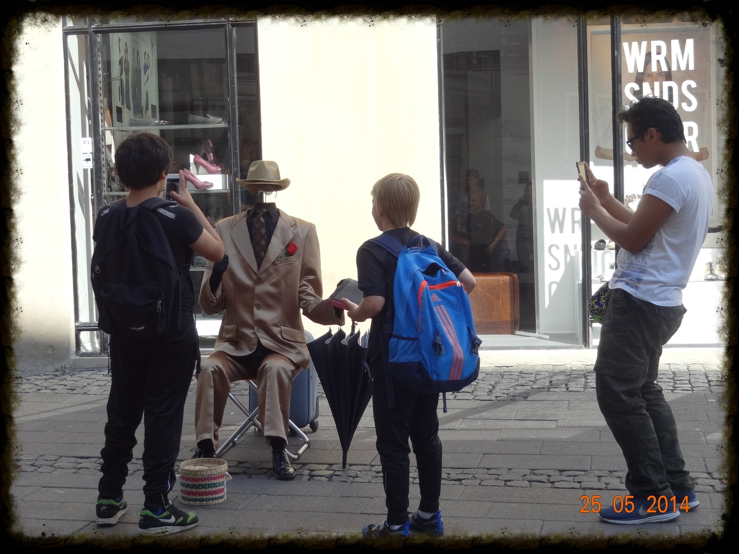 Students amused by street entertainment in Copenhagen this morning.